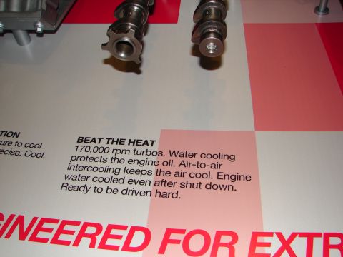 1992 Ford Taurus - Engine components and descriptive text highlight performance features like 170,000 rpm turbos and water cooling.
