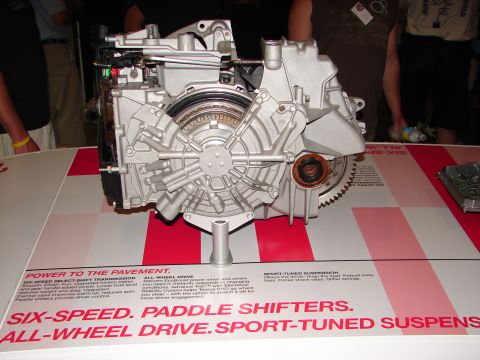 1992 Ford Taurus - A display shows a detailed transmission and drivetrain system, highlighting its advanced features and technology.