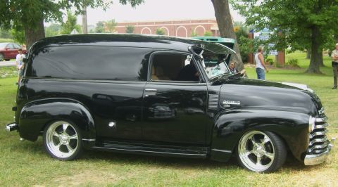 2007 Ford Mustang - This vintage Chevrolet panel van features a custom lowered stance and chrome wheels.