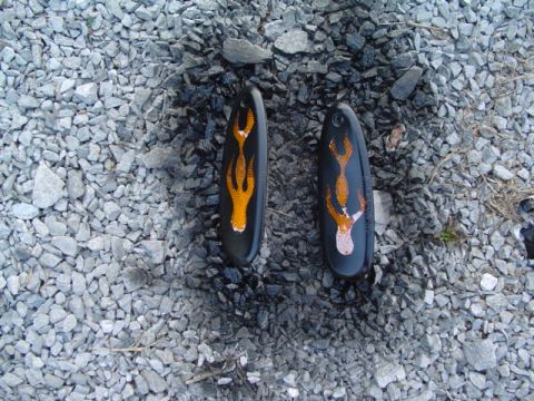 1999 Ford Taurus - Custom painted side marker lights with flame graphics are shown on a gravel surface.