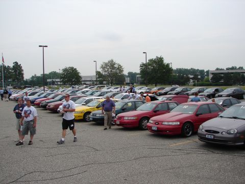 1992 Ford Taurus - A gathering of Ford Taurus cars, likely at a car show or convention.
