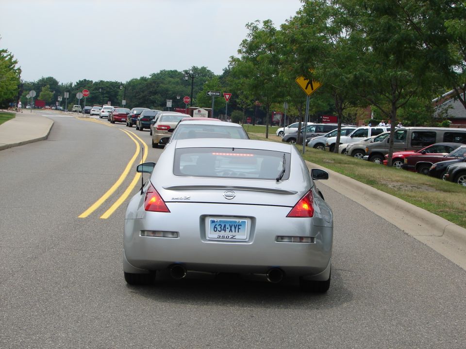 Silver Nissan 350Z rear view in traffic, license plate 634-XYF