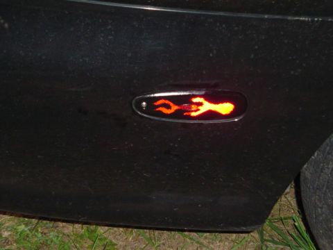 1999 Ford Taurus - A custom flame graphic illuminates the side marker light on this vehicle.