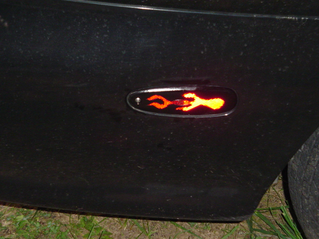Side marker light with flame graphic