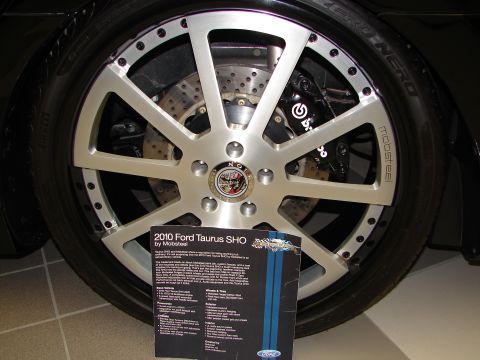1992 Ford Taurus - A custom wheel and tire assembly is shown with a brochure detailing a 2010 Ford Taurus SHO.