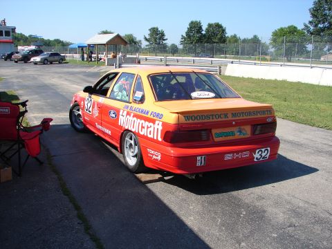 1992 Ford Taurus - This 1992 Ford Taurus race car, number 32, is seen from the rear at a track event.