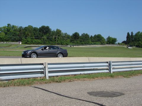 1992 Ford Taurus - Sedan on race track with another vehicle visible in the background.
