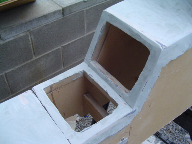 Modified center console with cutouts for storage or electronics