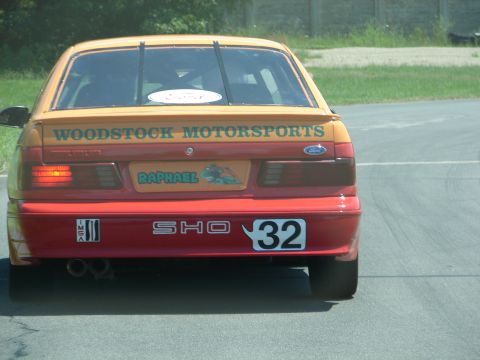 1992 Ford Taurus - Rear view of a 1992 Ford Taurus SHO race car, showing custom decals and racing number 32.