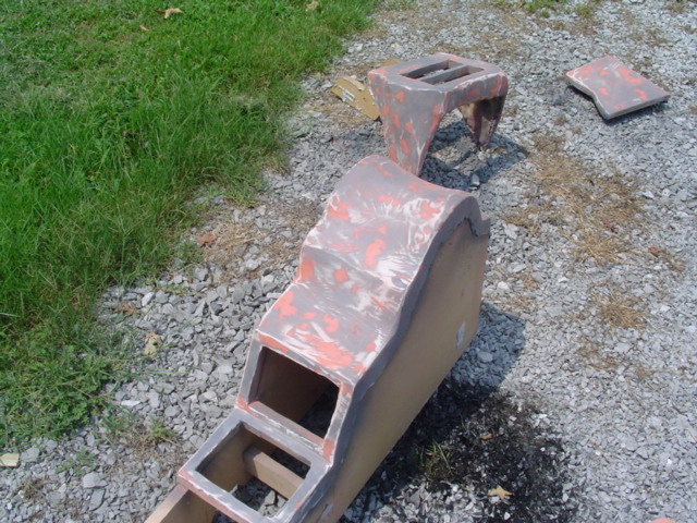 Car interior console parts on gravel
