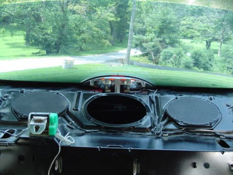1999 Ford Taurus - Interior view of dashboard speaker area with wiring and mounting hardware visible.