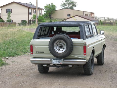 1978 Ford Bronco - This 1978 Ford Bronco is seen from the rear, its iconic spare tire carrier and boxy body style.