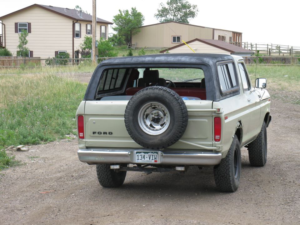 Rear view of a 1978 Ford Bronco with a spare tire mounted on the back