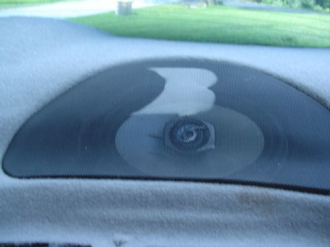 1999 Ford Taurus - Interior speaker grille and cone visible inside a vehicle.