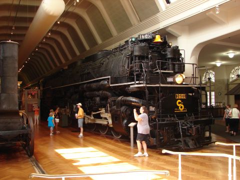 1992 Ford Taurus - A massive steam locomotive, numbered 1601, is displayed indoors with visitors observing.