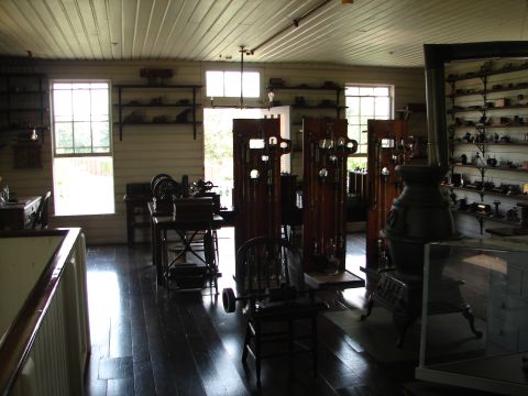 1992 Ford Taurus - This room appears to be a museum exhibit antique machinery and various items on shelves.