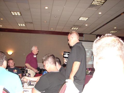 1992 Ford Taurus - Attendees at a convention, with a projector screen displaying text and graphics.