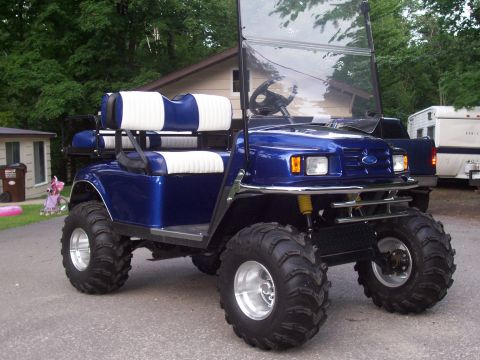 1978 Ford F-150 - This modified golf cart features oversized tires and a Ford emblem on its front grille.