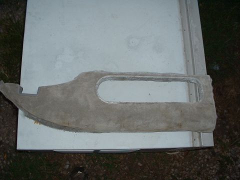 1994 GMC Suburban - A gray fabric interior trim piece with a large oval cutout is shown.