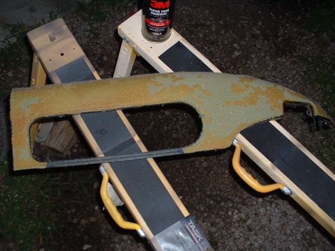 1994 GMC Suburban - A dashboard trim piece, likely being prepped for restoration, rests on sawhorses with a can of adhesive nearby adhesive nearby adhesive nea…