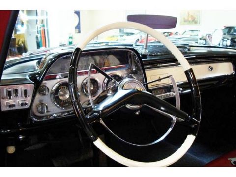 1991 Ford Crown Victoria - Close-up of a classic car's interior, a distinctive steering wheel and dashboard.