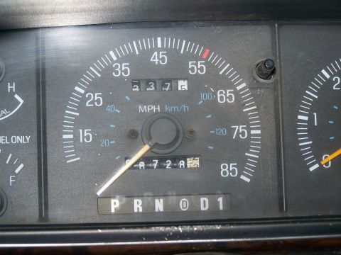 1989 Ford Bronco - Interior view of dashboard gauges, including the odometer and gear selector.