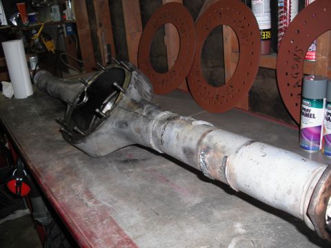 1991 Ford Bronco - A rear axle assembly is shown on a workbench, likely for repair or modification.