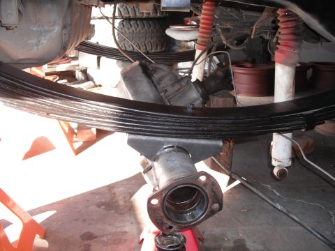 1991 Ford Bronco - Close-up view of a vehicle's rear axle and suspension system undergoing maintenance or repair.