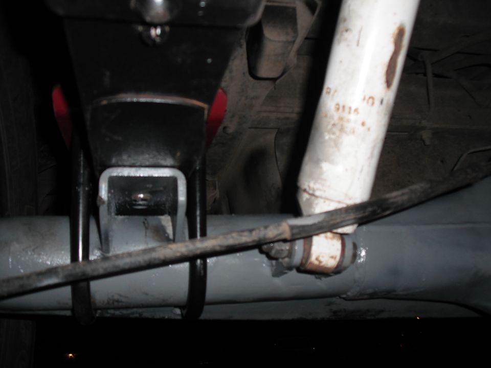 Close-up of rear axle with shock absorber and suspension bracket
