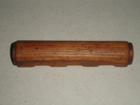 1989 Ford Bronco - Wooden shift knob with four indentations on the side, likely an aftermarket part.