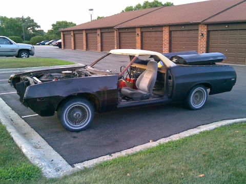 1972 Ford Ranchero - This 1972 Ford Ranchero is undergoing some work, with its doors off and engine visible.