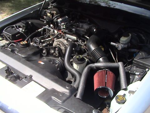 2000 Ford Crown Victoria - The engine compartment of a 2000 Ford Crown Victoria features an upgraded air intake system.