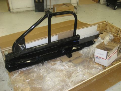 1978 Ford Bronco - Aftermarket rear bumper with tire carrier, packaged for shipping.