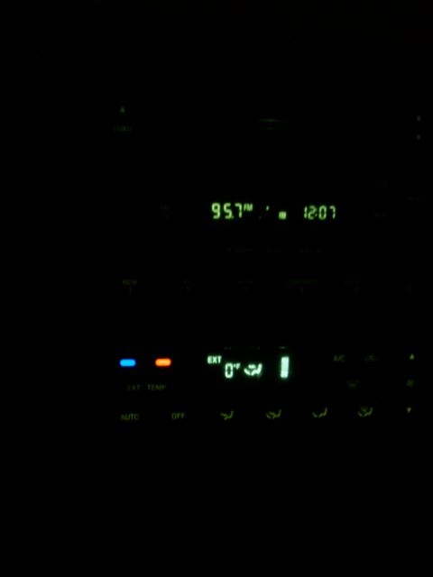 2005 Ford F-250 - The vehicle's interior climate control and radio display shows the external temperature at 0 degrees and the radio tuned to 95.7 FM.