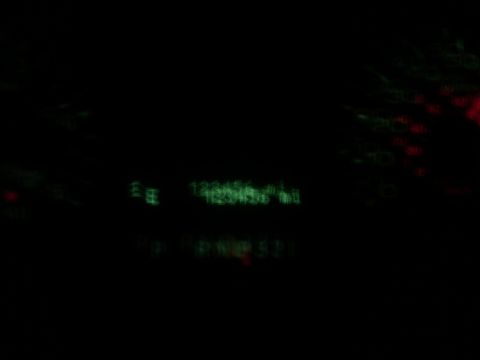 2005 Ford F-250 - Dashboard gauges illuminated at night, showing some text and readings.