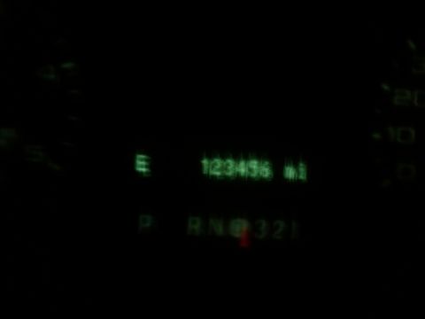 2005 Ford F-250 - The digital odometer displays 123,456 miles, with the gear selector illuminated on 'P'.