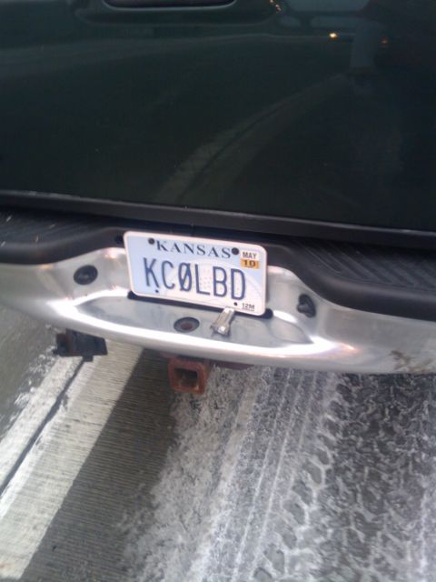 2005 Ford F-250 - Kansas license plate KCØLBD is mounted on the rear bumper of a truck.