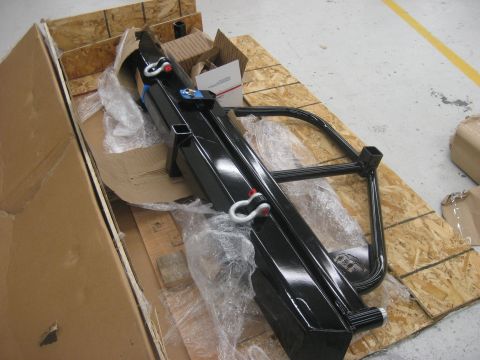 1978 Ford Bronco - This aftermarket bumper and tire carrier is packaged for shipping, not installed on a vehicle.