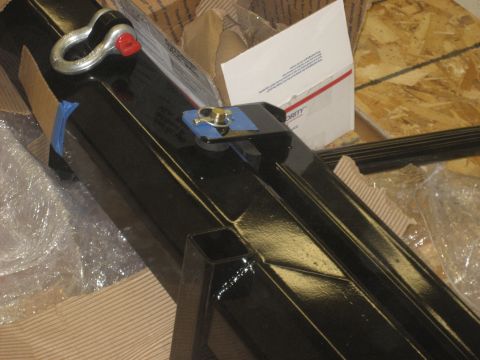 1978 Ford Bronco - A black metal part, possibly a bumper or frame component, is shown with a tow hook attachment.