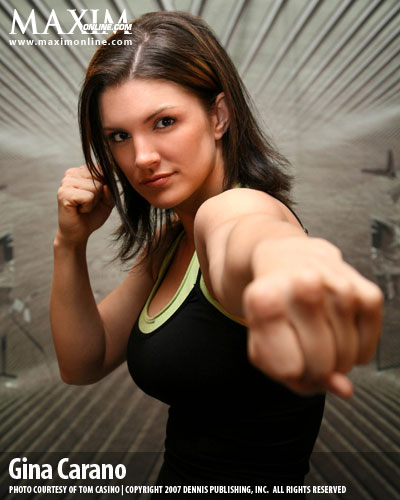 2007 Ford Mustang - Gina Carano is shown in a fighting stance against a textured background.