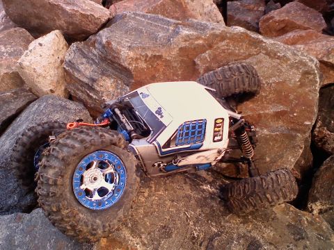 1996 Ford Bronco - RC rock crawler vehicle navigating a rocky terrain.
