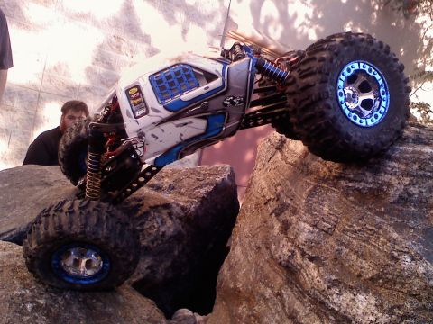 1996 Ford Bronco - A remote control rock crawler navigates a rocky terrain, demonstrating its off-road capabilities.