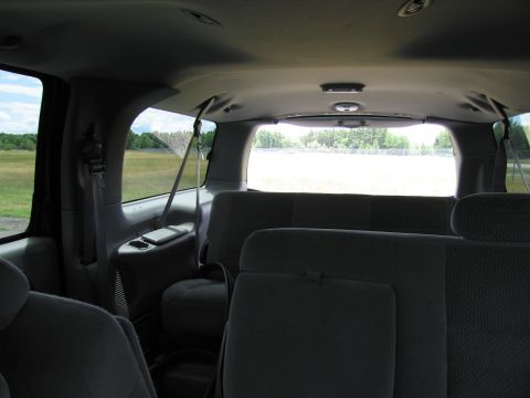 2001 Ford Crown Victoria - Rear interior view of a van or SUV with multiple rows of seats visible.