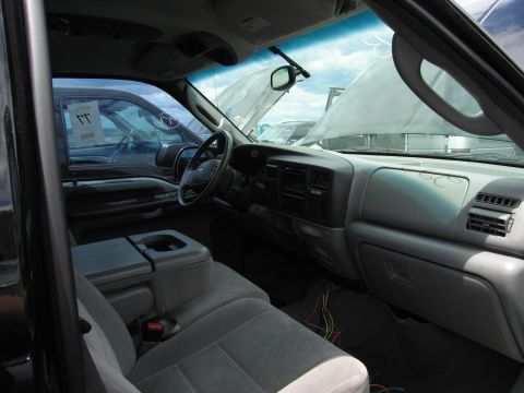 2001 Ford Crown Victoria - Interior view of a pickup truck, with another vehicle visible through the driver's side window.