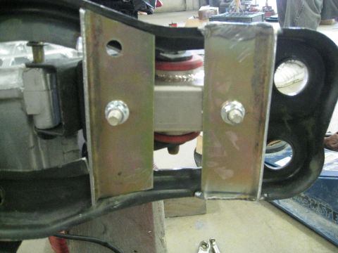 1994 Ford Probe - Detail of a suspension part, possibly from a car, showing metal brackets and springs.
