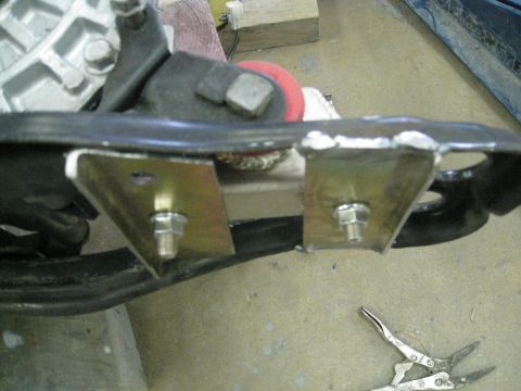 1994 Ford Probe - Custom metal plates are bolted to an engine mount bracket, suggesting a modification or repair.