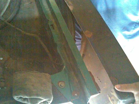 1972 Ford Ranchero - Detail of a rusty car part, likely from the undercarriage.