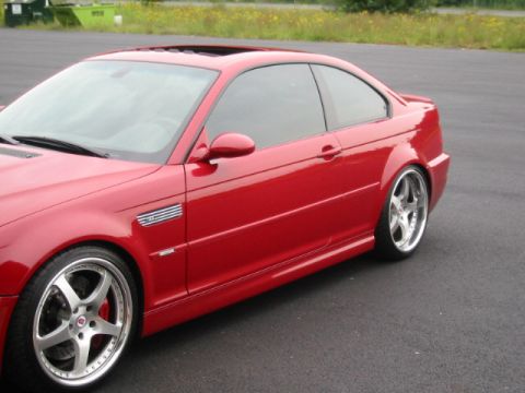 1998 Ford Crown Victoria - Red coupe with aftermarket wheels parked on asphalt, with a grassy field in the background.