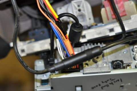 1996 Ford Bronco - Close-up of car stereo wiring harness, with handwritten date 'July 2010' visible on the unit.
