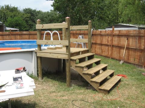 1994 Ford Bronco - Deck and pool ladder structure in a backyard setting.
